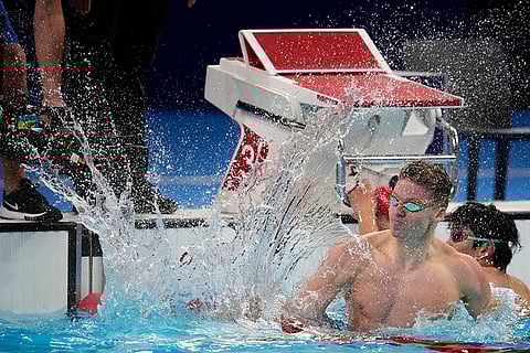 Leon Marchand celebrates men's 200-meter breaststroke gold